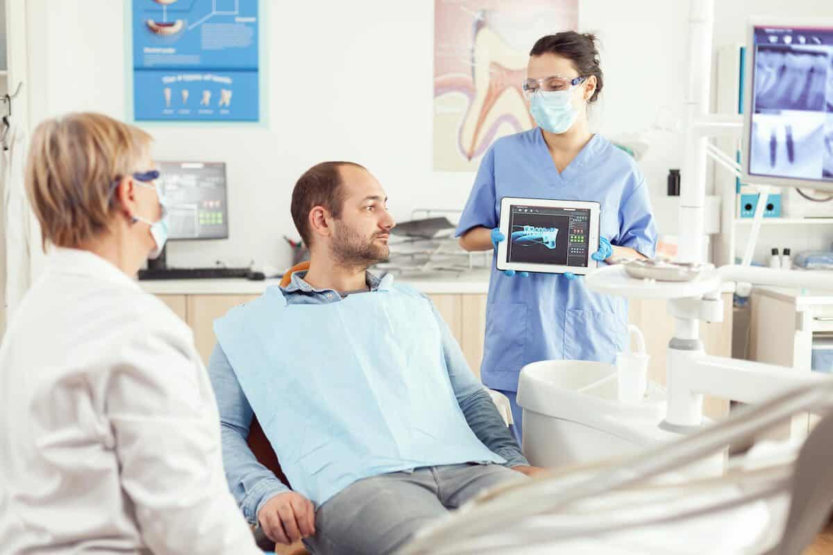 Laser teeth whitening treatment being applied by a dental professional Burnley